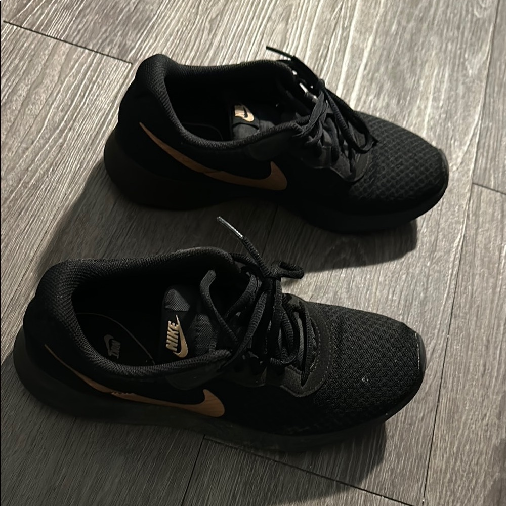 Nike Black Sneakers with Gold Swoosh
